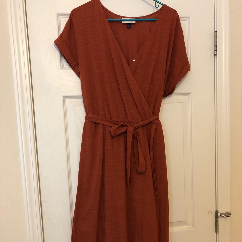 A burnt orange wrap dress